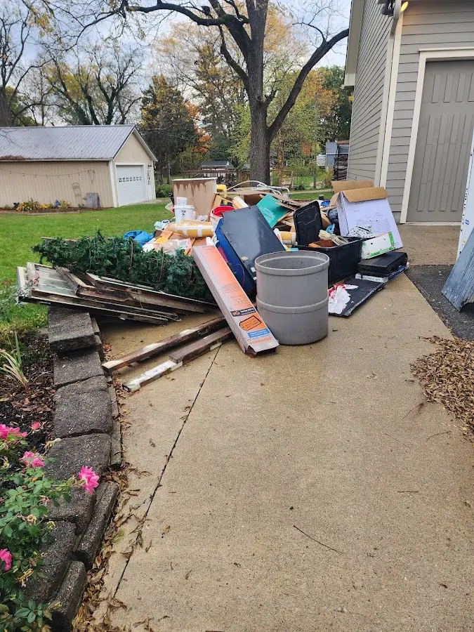 Dumpster being loaded with debris for Estate Cleanout Dumpster Rental in Nevada